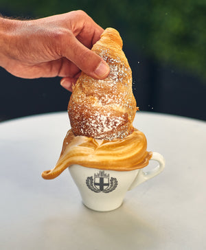 Croissant and Flatwhite latte art splash
